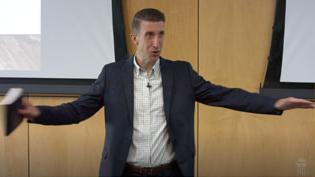 Dr. Kimble teaching Theology II in a lecture hall.